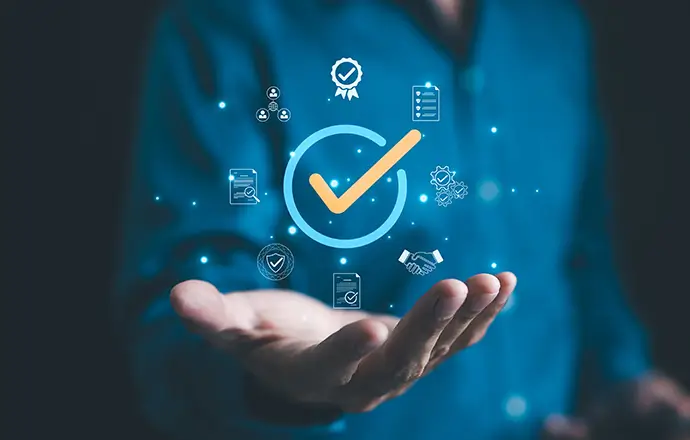 Businessman holding a digital icon of a checkmark with quality assurance and certification symbols, standard compliance and guarantee. quality control, automation process, Standardization management