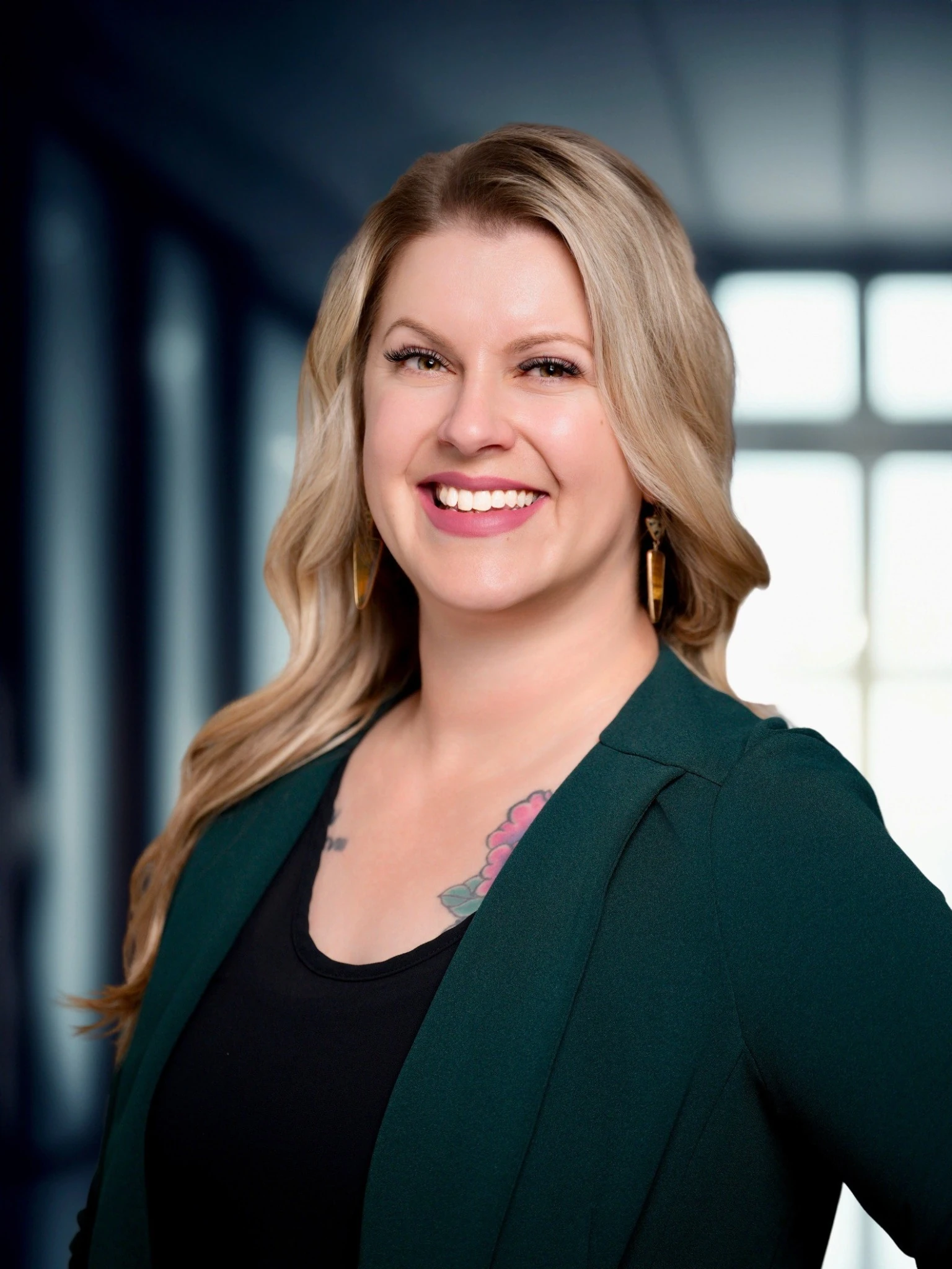 Professional headshot of Melissa Suedbeck smiling in business attire