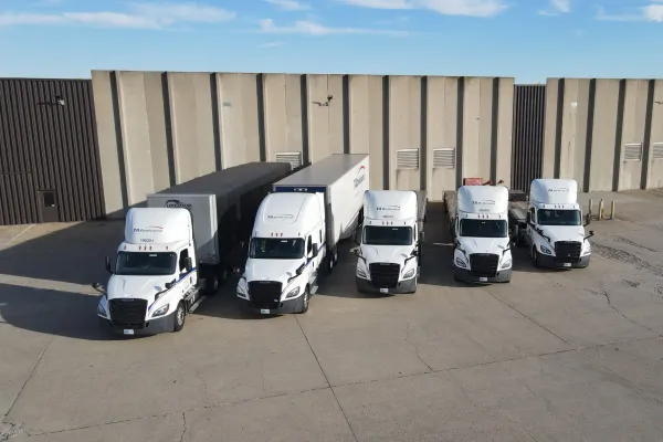 Private fleet conversion with dedicated trucks staged at distribution center