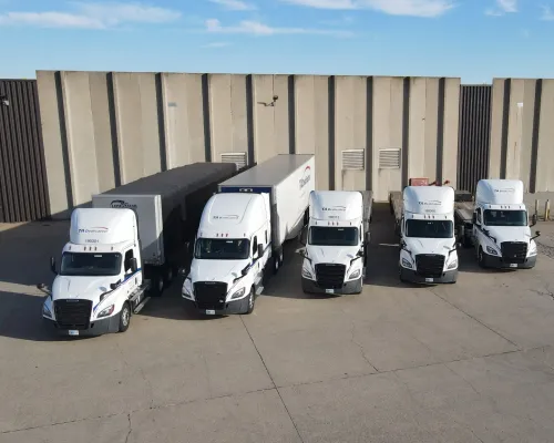 Private fleet conversion with dedicated trucks staged at distribution center